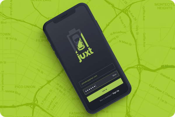 Juxt login app screen on top of a green roadmap background